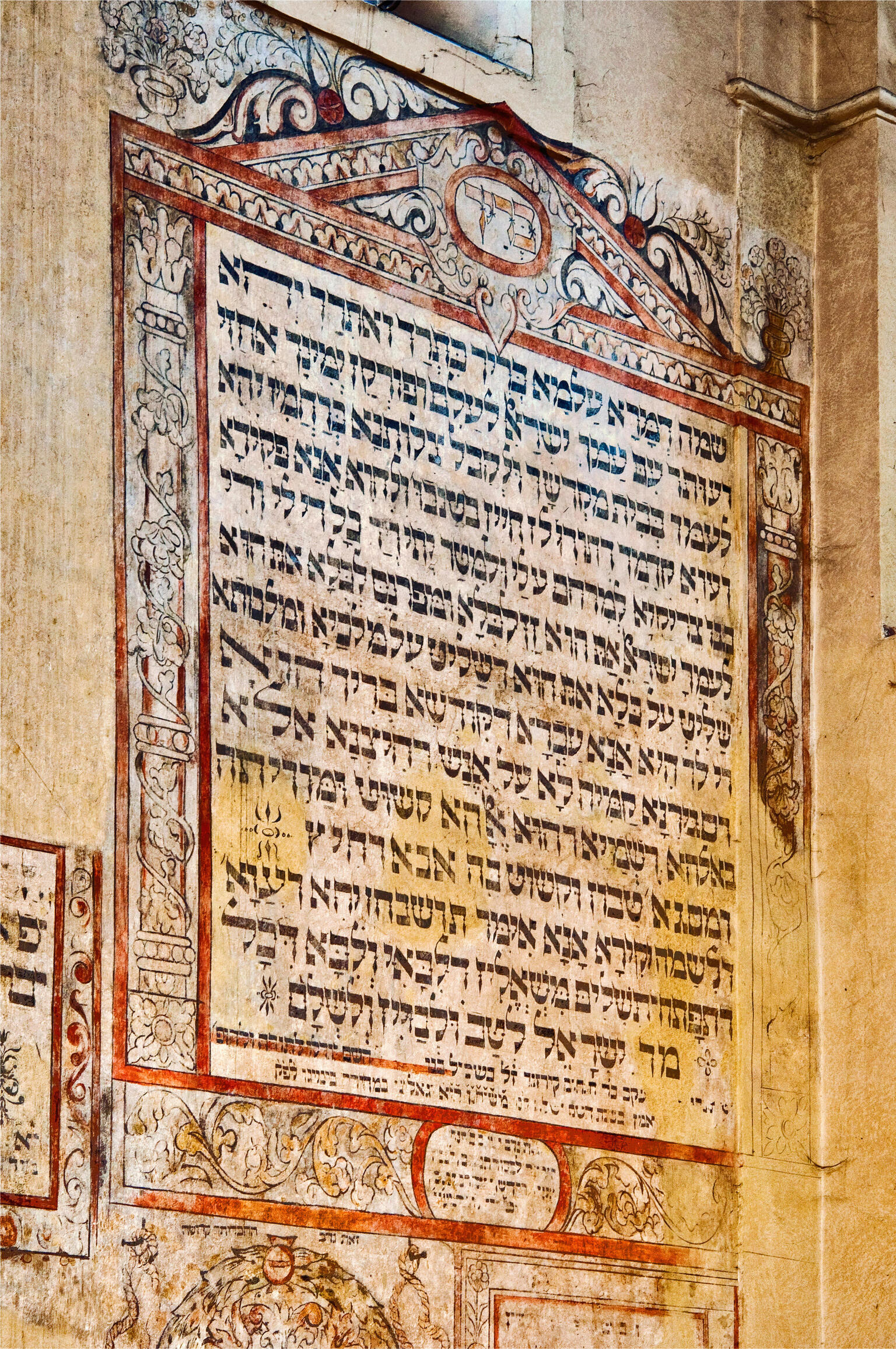 Wall painting with Hebrew text in decorated border. 