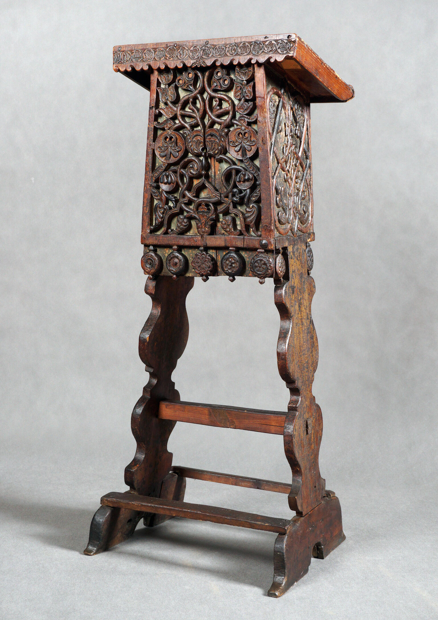 Wooden lectern with decorations.