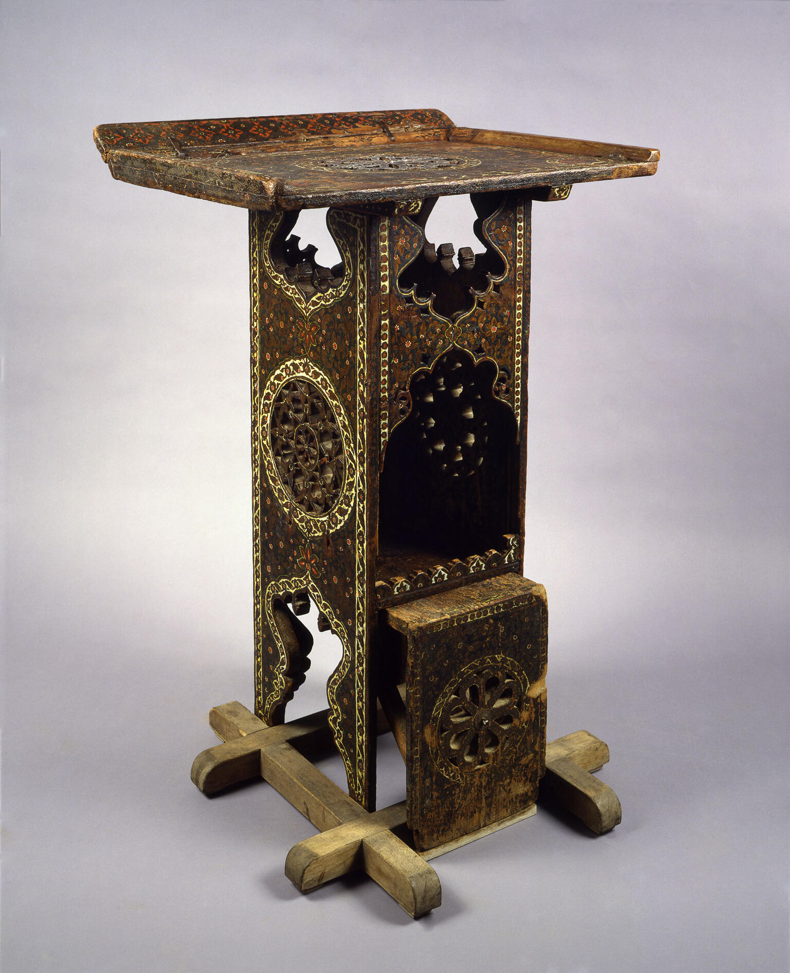 Wooden lectern with geometric designs.