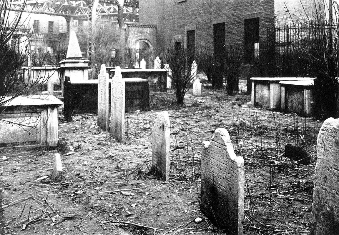 Photograph of headstones in cemetery. Photograph of headstones in cemetery.
