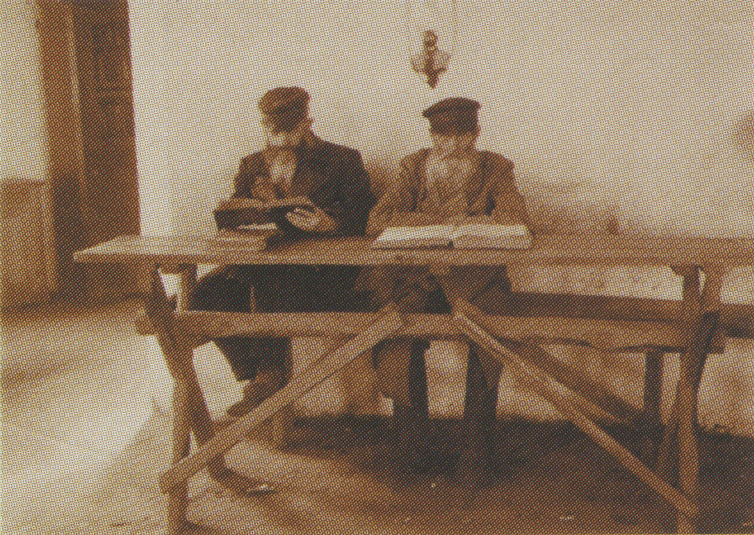 Photograph of two men studying.