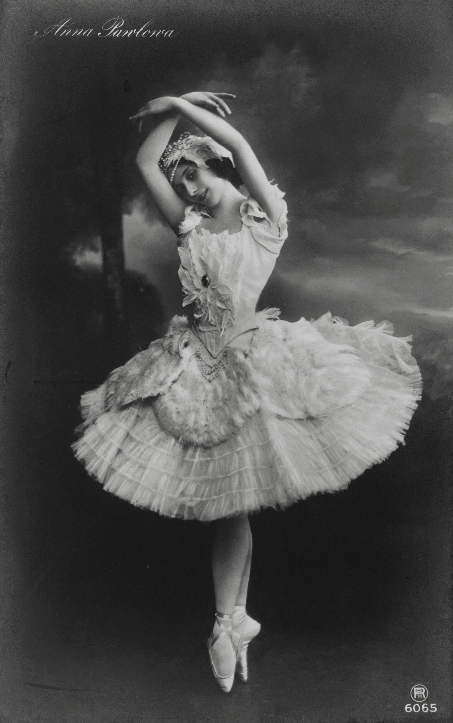 Photograph of ballerina on pointe wearing tutu.