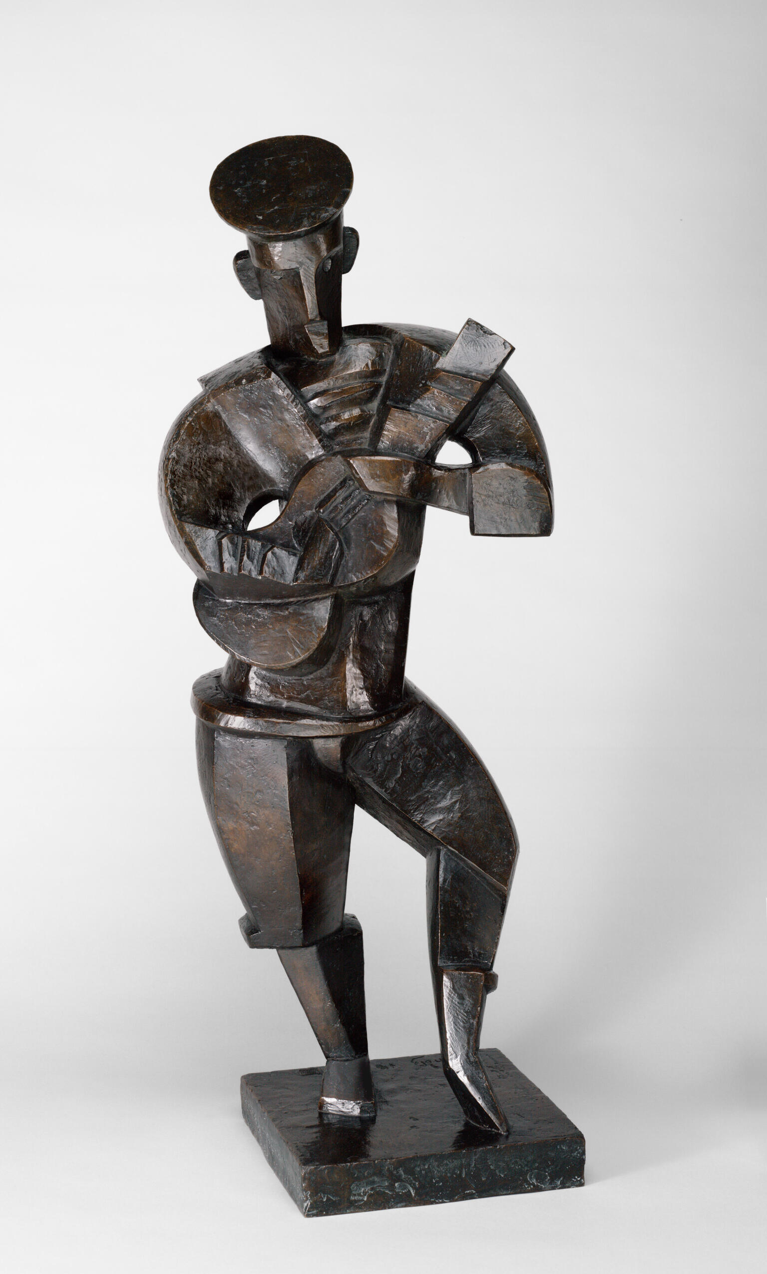 Sculpture of abstract figure standing and holding a guitar. Sculpture of abstract figure standing and holding a guitar.