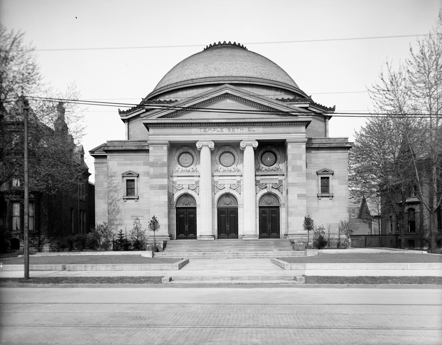 Photograph of exterior of building with domed roof. Photograph of exterior of building with domed roof.
