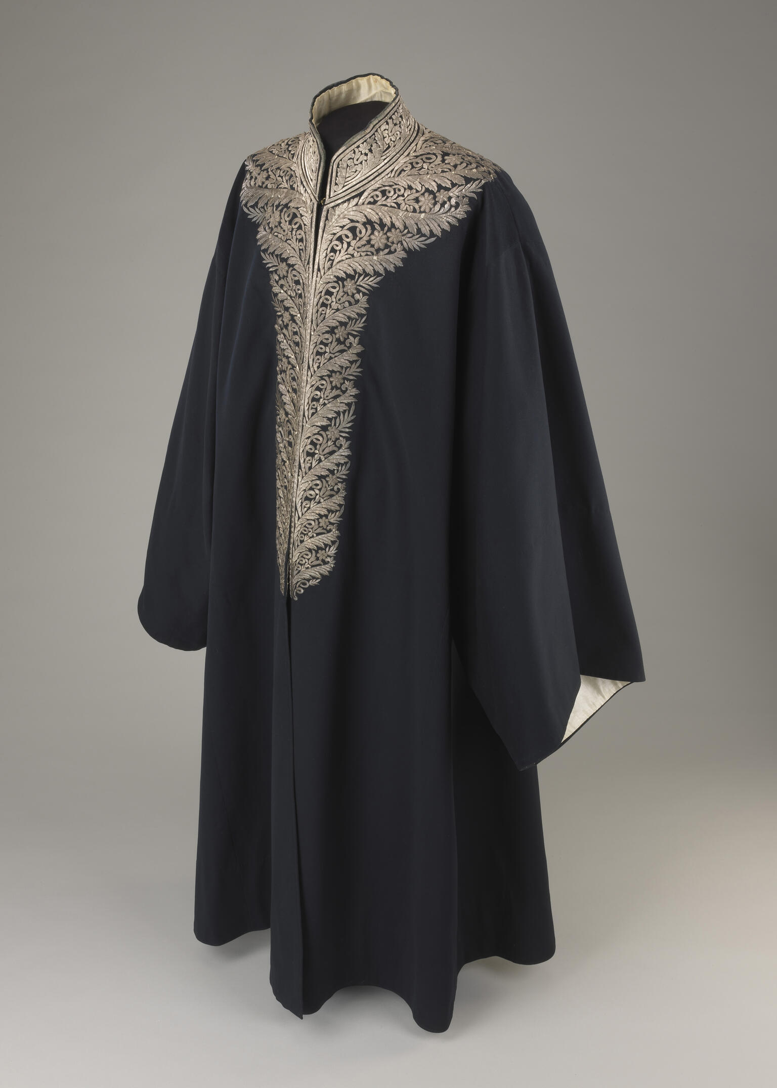 Coat with an ornately embroidered neckline.