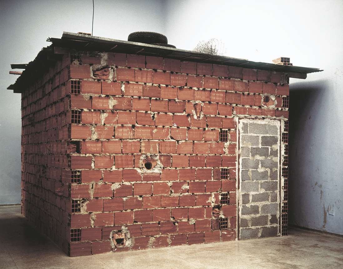 Installation depicting doorless and windowless brick structure. Installation depicting doorless and windowless brick structure.