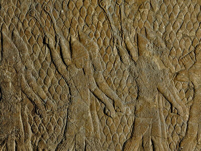 Relief with diamond pattern of people in cone-shaped hats swinging slingshots