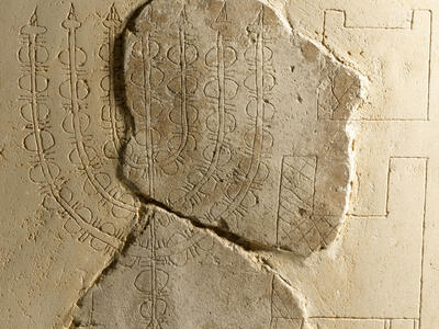 Plaster relief with image of seven-branched candelabrum. 