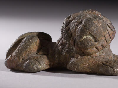 Bronze weight in shape of crouching lion.