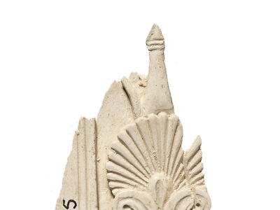 Ivory carving of a vertical series of four palmettes.