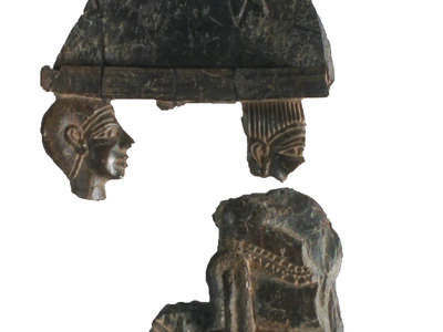 Ivory carving in two disconnected fragments, one with two heads and the other one with a body on a throne.