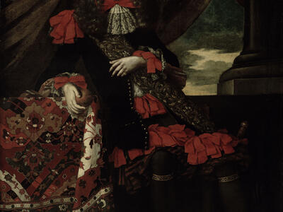 Portrait painting of man dressed in beribboned robe, standing with one arm resting on a table covered with cloth, next to thick curtains.