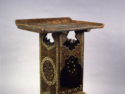 Wooden lectern with geometric designs.