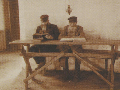 Photograph of two men studying.