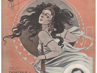 Poster with English text and image of woman with flowing hair, and photograph of man in right bottom corner.