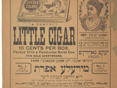 Page with printed Yiddish and Englsh text and two small images of a box and a face in profile.