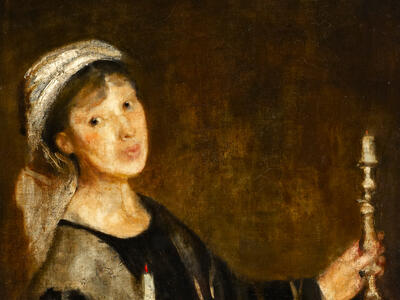 Portrait of woman holding candles.