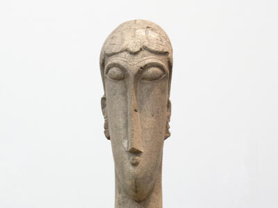 Sculpture of elongated head and neck.