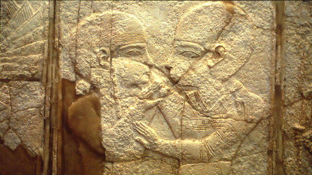 Ivory inlay of two figures in profile embracing. 