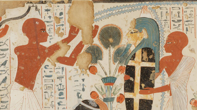 Mural of crouching woman with hand on her head next to upright mummy held up by figure in tunic, as another figure in tunic raises arms above woman, with hieroglyphic text in background. 