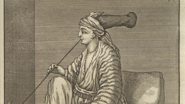 Jewish woman in Cairo Print of seated person in large hat and robes facing to the left smoking a very long pipe.