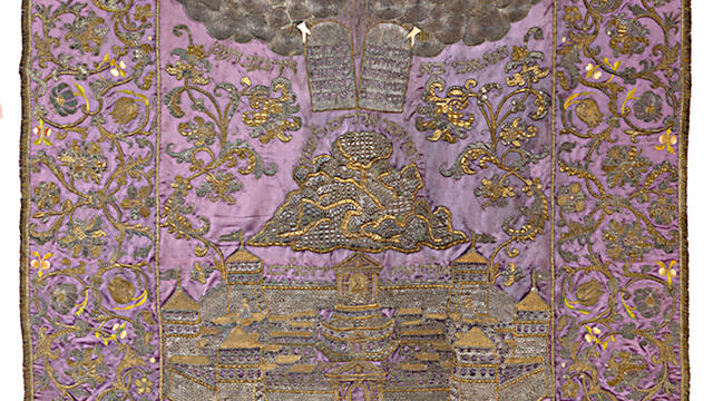 Torah Ark Curtain Cloth with embroidered image of tablets in clouds above mountain and city.