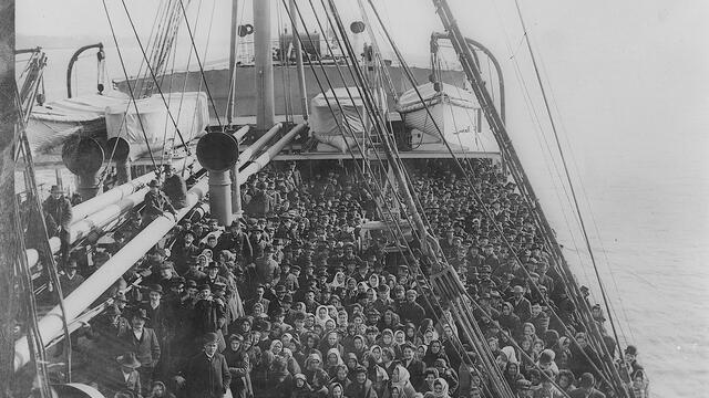 A ship deck filled with people.
