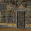 Photograph of room with wood walls painted with Hebrew text, animals, and floral designs.
